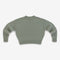 Green sweater on a light gray background
