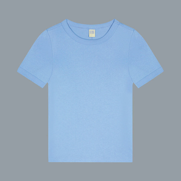 Plain light blue t-shirt on a gray background