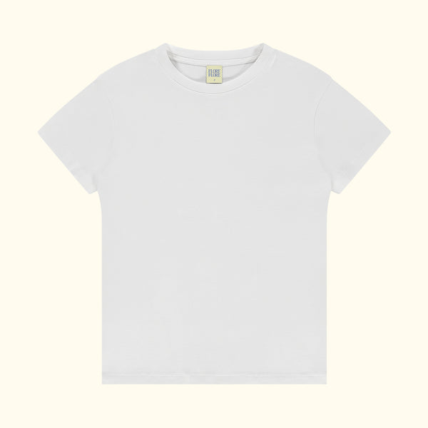 Plain white t-shirt on a light beige background
